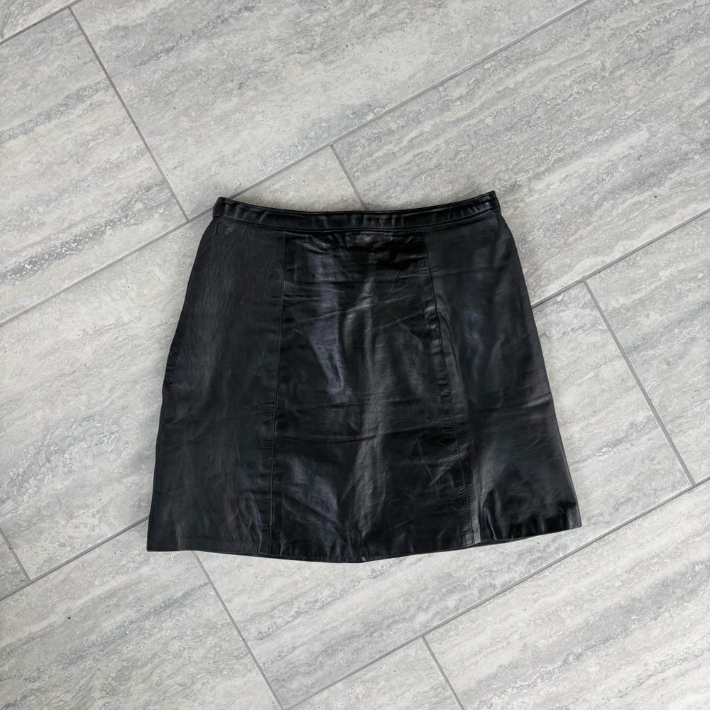 Black Leather Mini Skirt A-line silhouette and paneled construction‎